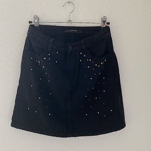 Denim black skirt with pearl details. Really good shape, like new!